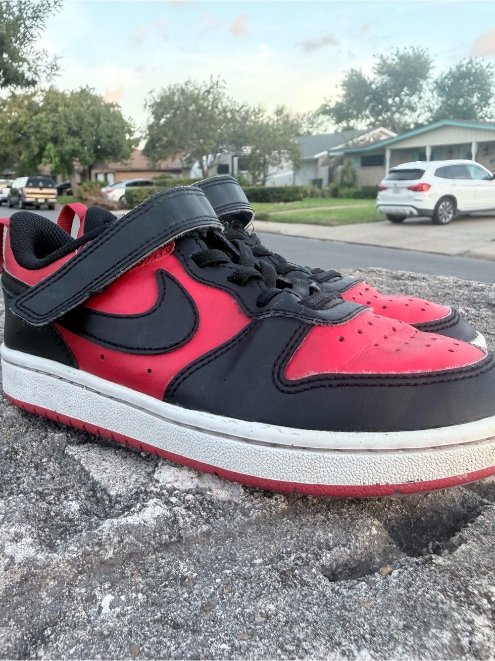 Nike Kids Black and Red Low-Top Sneakers with Velcro Strap